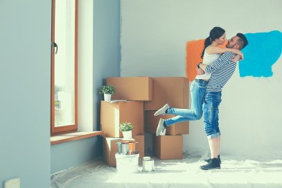 Guy and girl embracing as they get their new home