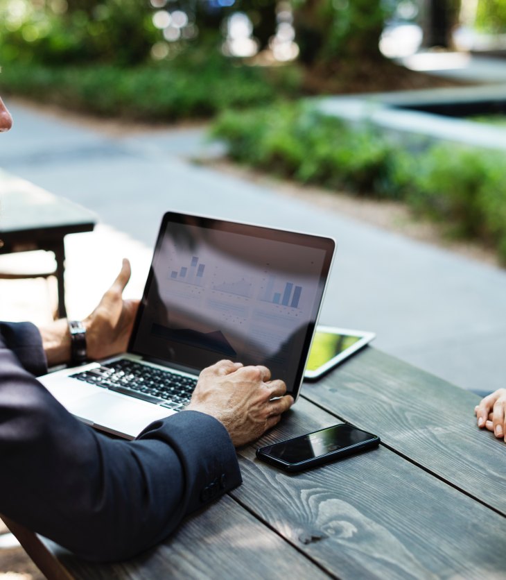 Two people sitting outside for a job interview
