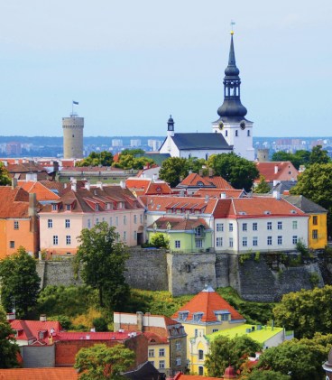 Image of the Estonian capital, Tallinn and it's old rooftops and Estonian flag